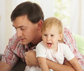 Father holding baby girl