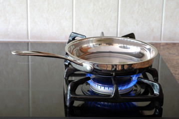 Cooking in a frying pan on a gas stove