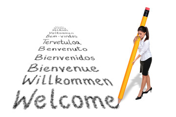 Businesswoman writing Welcome in European languages