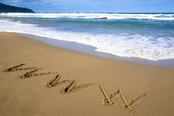 internet symbol draw on beach