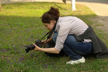 a woman photographer making a shot