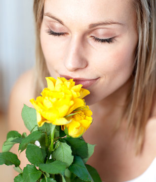 Attractive Woman Smelling Roses