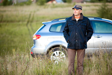 adult man and car as the background