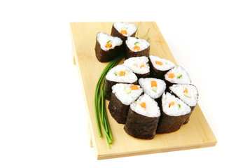 rolls of sushi on wood