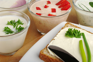 Bread on plate with cream cheese and various spreads