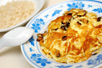 Fried or scrambled egg with rice