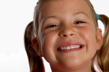 Closeup of pretty little girl smiling