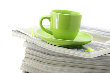 Magazines and coffee cup