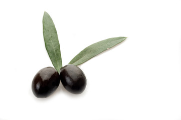 black olives with leaf on white