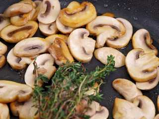 braised mushrooms in a black pan