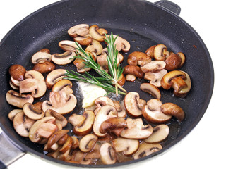 braised champignon, butter & herb in a pan isolated on white
