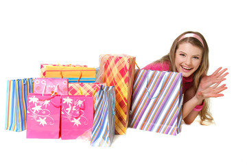 young happy girl with shopping bags over white