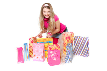 young happy girl with shopping bags over white