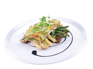 baked fish & asparagus gratin isolated on white background