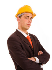 young engineer portrait with a yellow helmet, isolated on white