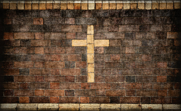 christian cross in brick wall