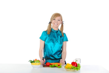 beautiful young girl preparing a salad