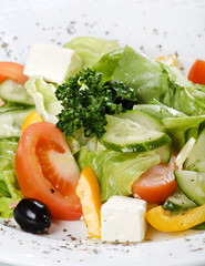 Caesar salad in a white plate.