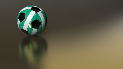 Glossy Nigeria soccer ball on golden metal surface
