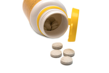 Pills spilling out of a prescription bottle