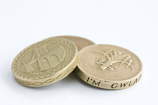 British one pound coins on a white background