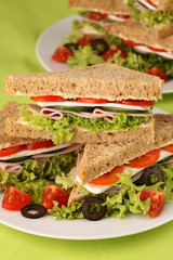 Healthy sandwiches with ham, camembert and vegetables