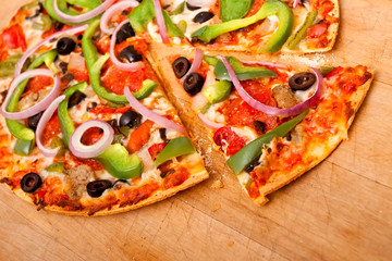 Pizza with vegetables and pepperoni