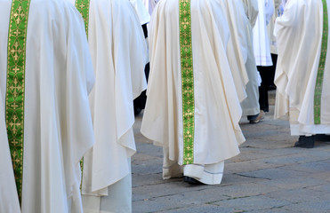 Row of male religious going to church
