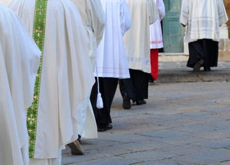 Row of male religious going to church
