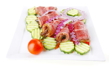 served beef rolls on white