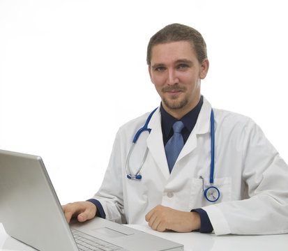 Doctor sitting in office at desk