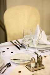 elegant dinner table with flowers and glass