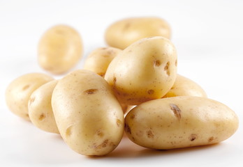 Yellow potatoes on a white background