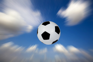 Fototapeta na wymiar Football into the sky