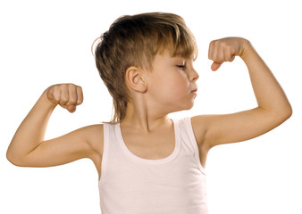 Little boy flexing biceps