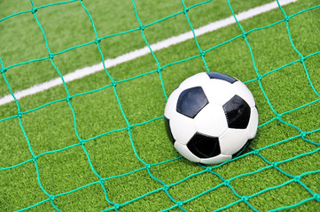 Soccer ball in the goal net