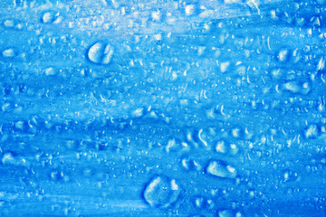 Blue textured (icy look) surface with water droplets