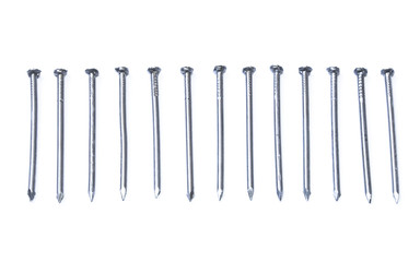 Row of iron nails isolated on white