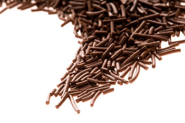 chocolate sprinkles on white background