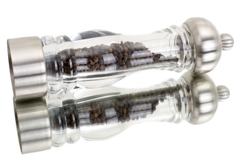 glass grinder of pepper isolated on a white background