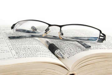 dictionary & pen with glasses