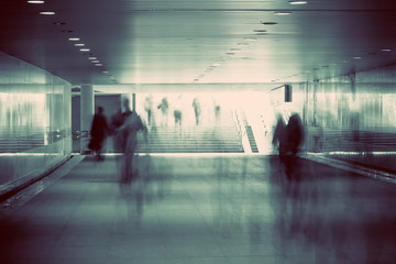 motion blurred of people walking in subway