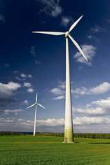 Windmills against a blue sky