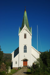 Fototapeta na wymiar White Church and Blue Sky in Northern Norway