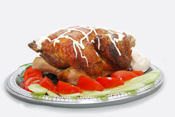 Grill chicken with vegetables on silver plate