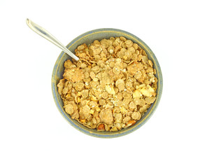 Banana and nut granola cereal with spoon