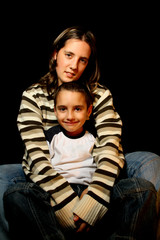 aunt and nephews over black background - 22595265