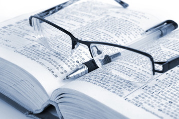 dictionary & pen with glasses