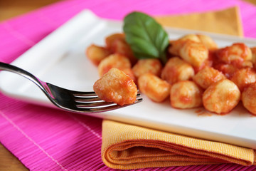 Gnocchi on a fork - blurred background