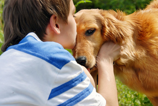 Boy Kissing Dog